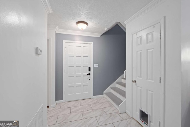 834 Lake Hollow Blvd SW, Marietta, GA 30064 - entrance foyer with stairs, a textured ceiling, and ornamental molding