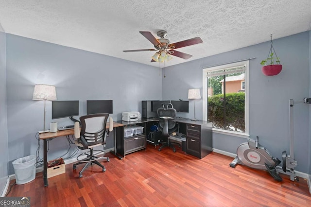834 Lake Hollow Blvd SW, Marietta, GA 30064 - office with wood finished floors, ceiling fan, and a textured ceiling