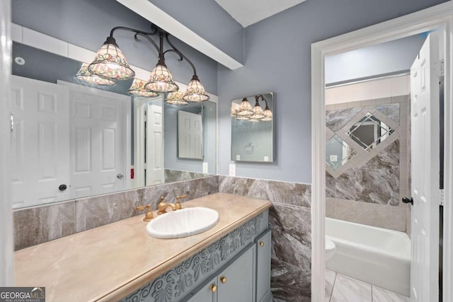 834 Lake Hollow Blvd SW, Marietta, GA 30064 - bathroom with vanity, marble finish flooring, and tub / shower combination