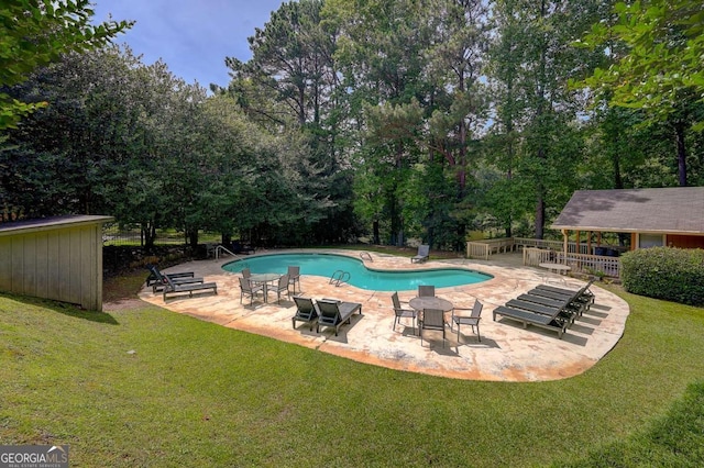 834 Lake Hollow Blvd SW, Marietta, GA 30064 - outdoor pool featuring a lawn, a patio area, and view of scattered trees