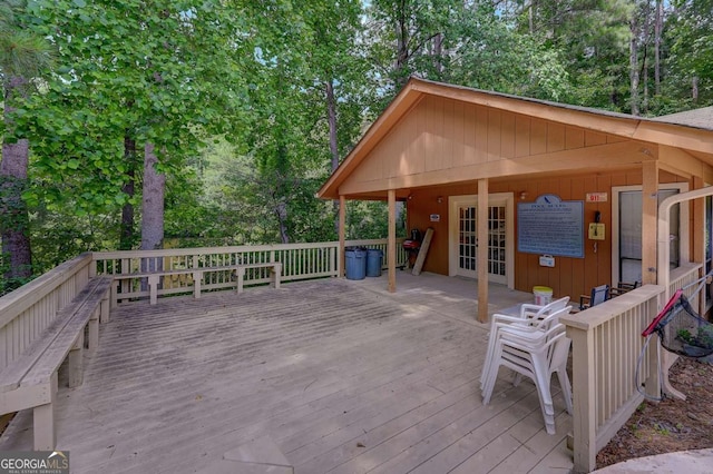 834 Lake Hollow Blvd SW, Marietta, GA 30064 - wooden deck with french doors and view of scattered trees