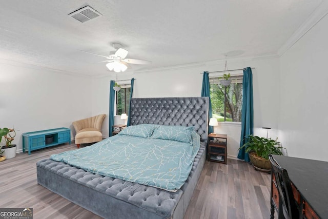 834 Lake Hollow Blvd SW, Marietta, GA 30064 - bedroom featuring wood finished floors, crown molding, and ceiling fan