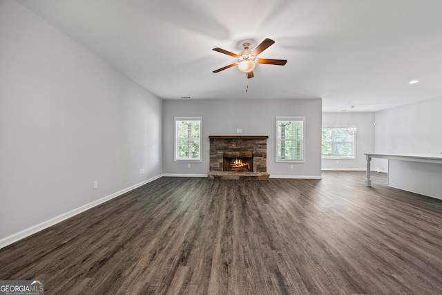 502 Wilbanks Rd, Alto, GA 30510 - unfurnished living room with dark wood-type flooring, a ceiling fan, and a fireplace