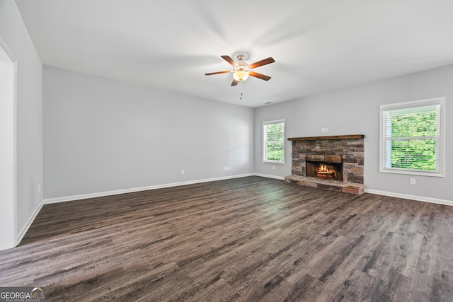 502 Wilbanks Rd, Alto, GA 30510 - unfurnished living room featuring a ceiling fan, dark wood-style flooring, and a fireplace