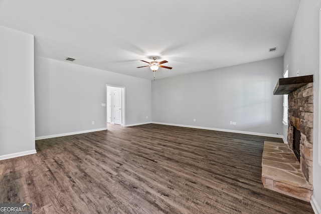 502 Wilbanks Rd, Alto, GA 30510 - unfurnished living room with ceiling fan, a fireplace, and dark wood-type flooring
