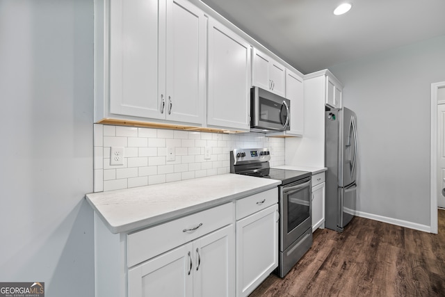 502 Wilbanks Rd, Alto, GA 30510 - kitchen featuring appliances with stainless steel finishes, dark wood finished floors, white cabinetry, tasteful backsplash, and light countertops