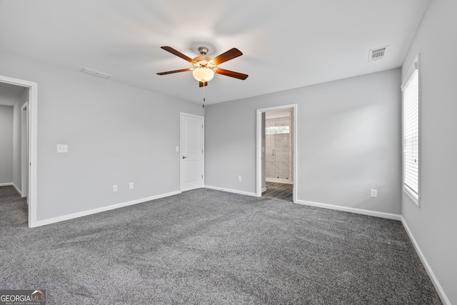 502 Wilbanks Rd, Alto, GA 30510 - unfurnished bedroom featuring dark colored carpet, ceiling fan, and ensuite bath