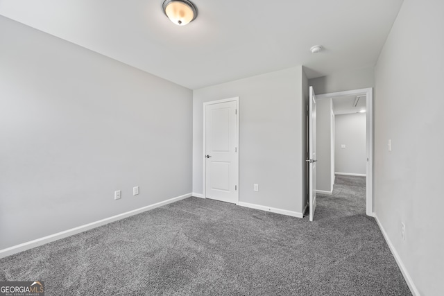 502 Wilbanks Rd, Alto, GA 30510 - unfurnished bedroom with dark colored carpet and attic access