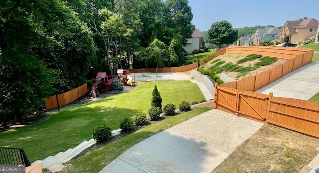 3499 Lake Mill Rd, Buford, GA 30519 - fenced yard featuring a playground, a residential view, and a gate