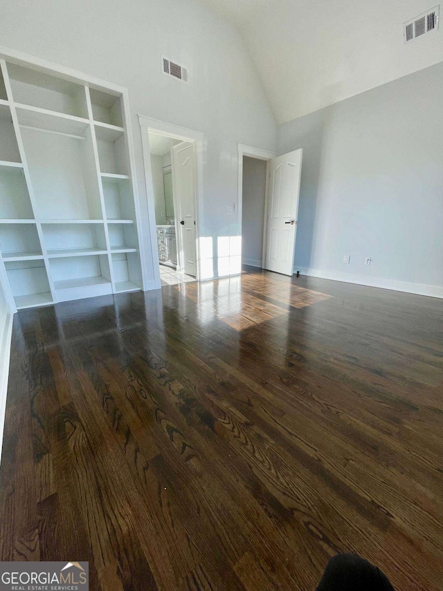 3499 Lake Mill Rd, Buford, GA 30519 - unfurnished bedroom featuring wood finished floors and high vaulted ceiling