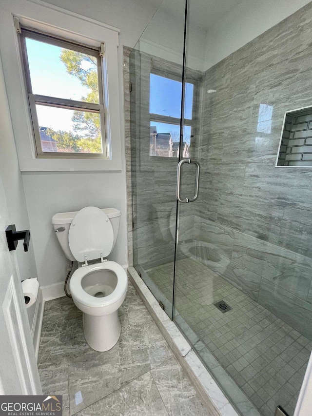 3499 Lake Mill Rd, Buford, GA 30519 - bathroom with baseboards and a stall shower