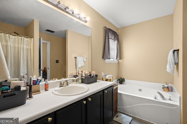 7030 Kingston Ln, Mcdonough, GA 30253 - full bath featuring vanity, a garden tub, and a textured ceiling