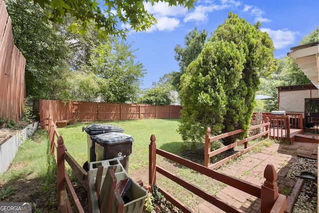 7030 Kingston Ln, Mcdonough, GA 30253 - fenced backyard with a wooden deck