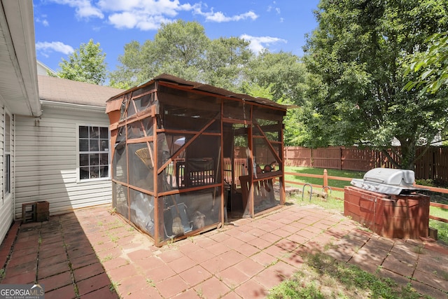 7030 Kingston Ln, Mcdonough, GA 30253 - fenced backyard featuring a sunroom and a patio area