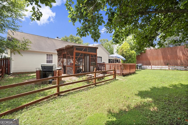 7030 Kingston Ln, Mcdonough, GA 30253 - fenced backyard with a sunroom and a wooden deck