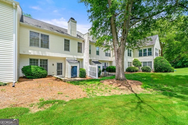 1003 Cannongate Xing SW, Marietta, GA 30064 - back of property with a chimney and a yard