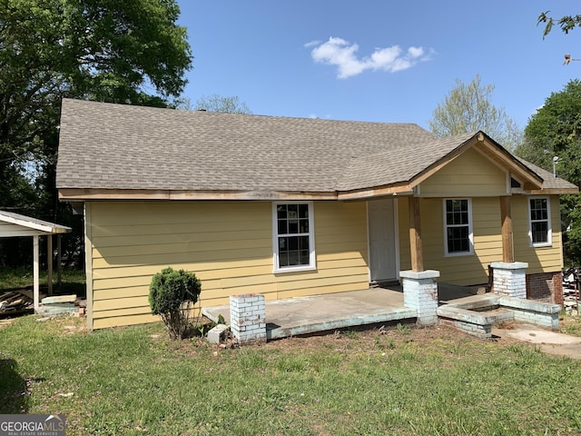 239 E Currahee St, Toccoa, GA 30577 - view of front of home featuring a front yard and roof with shingles