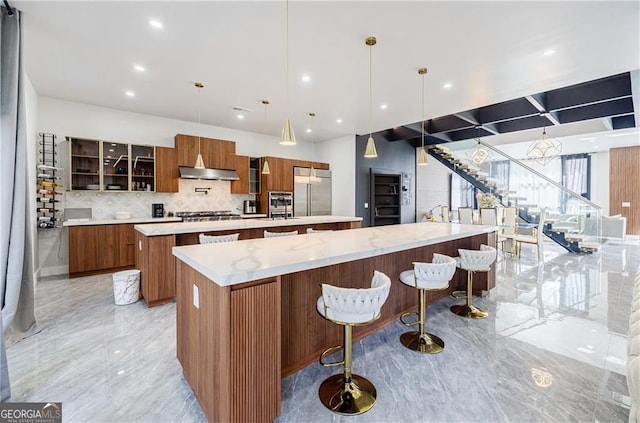 1812 Hunters Gln, Marietta, GA 30062 - kitchen with a large island, appliances with stainless steel finishes, modern cabinets, under cabinet range hood, and recessed lighting