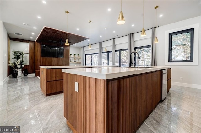 1812 Hunters Gln, Marietta, GA 30062 - kitchen with a large island, modern cabinets, light marble finish flooring, light countertops, and brown cabinets