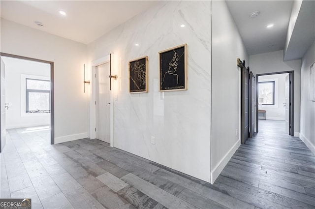 1812 Hunters Gln, Marietta, GA 30062 - corridor with a barn door, wood finished floors, and plenty of natural light