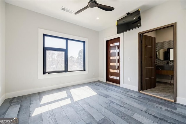 1812 Hunters Gln, Marietta, GA 30062 - unfurnished bedroom with wood finished floors, ensuite bathroom, recessed lighting, ceiling fan, and a spacious closet