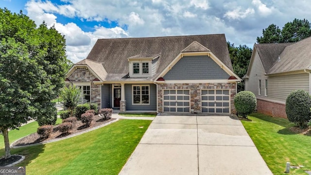 21 Creekview Dr SE, Cartersville, GA 30120 - craftsman-style home with stone siding, concrete driveway, a garage, and a front yard