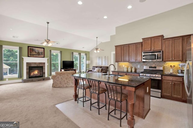 21 Creekview Dr SE, Cartersville, GA 30120 - kitchen with stainless steel appliances, ceiling fan, a breakfast bar, plenty of natural light, and recessed lighting