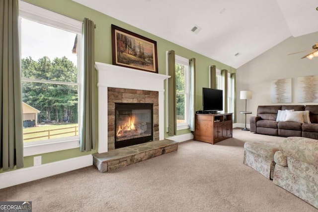 21 Creekview Dr SE, Cartersville, GA 30120 - carpeted living room with vaulted ceiling, a fireplace, and a ceiling fan