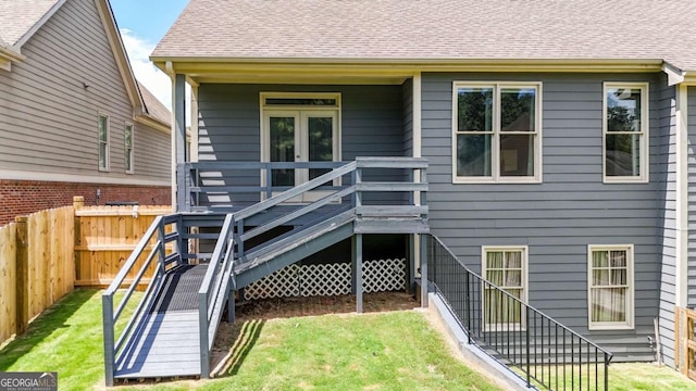 21 Creekview Dr SE, Cartersville, GA 30120 - rear view of property with stairway, a fenced backyard, and roof with shingles