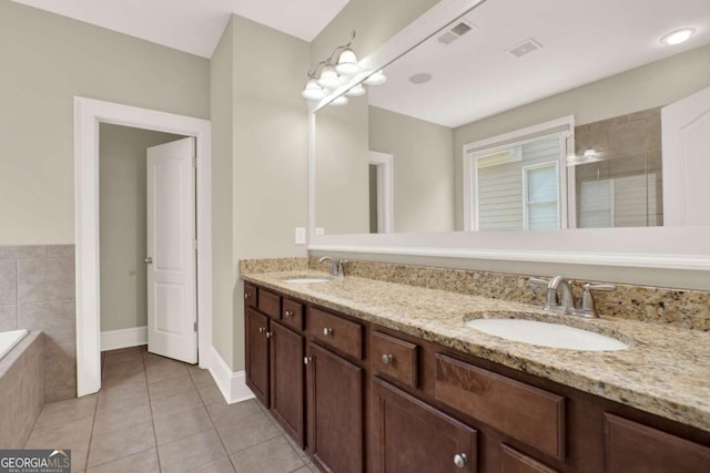 21 Creekview Dr SE, Cartersville, GA 30120 - full bathroom with double vanity, tile patterned floors, tiled bath, and a tile shower