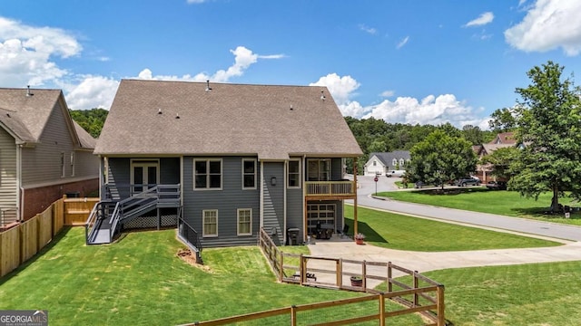 21 Creekview Dr SE, Cartersville, GA 30120 - back of house with a fenced backyard and a shingled roof