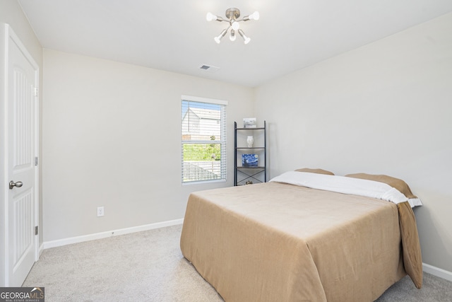 7814 Messina Ct, Lithia Springs, GA 30122 - bedroom with light carpet and a chandelier