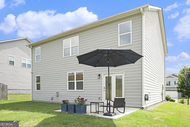 7814 Messina Ct, Lithia Springs, GA 30122 - back of house featuring a yard and a patio area