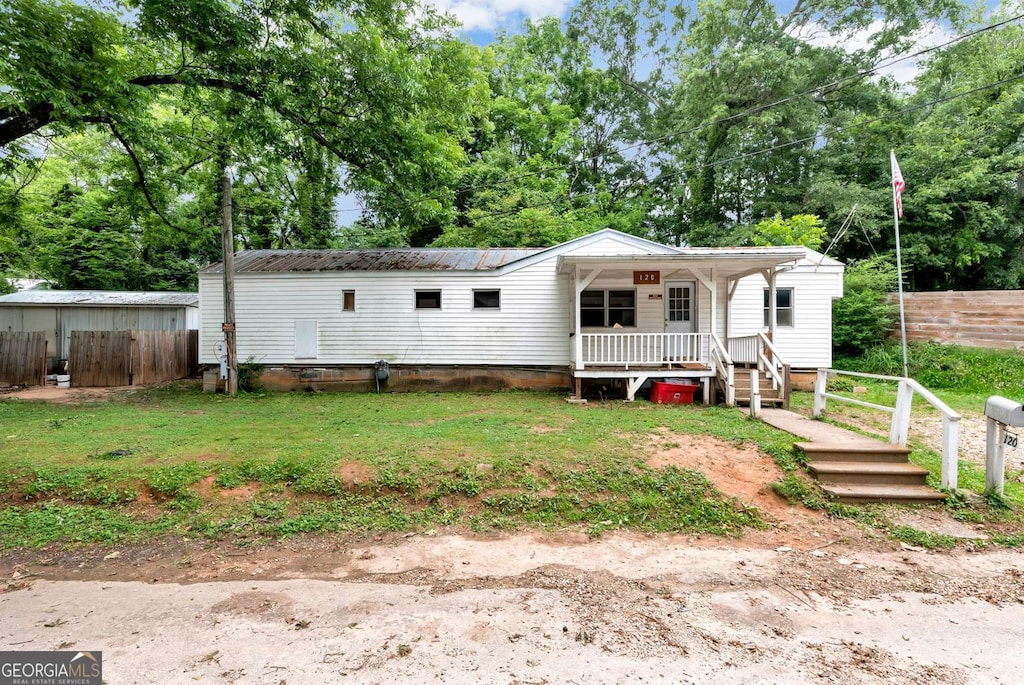 120 Hill Pl, Toccoa, GA 30577 - view of front of house with a porch, a metal roof, and view of scattered trees