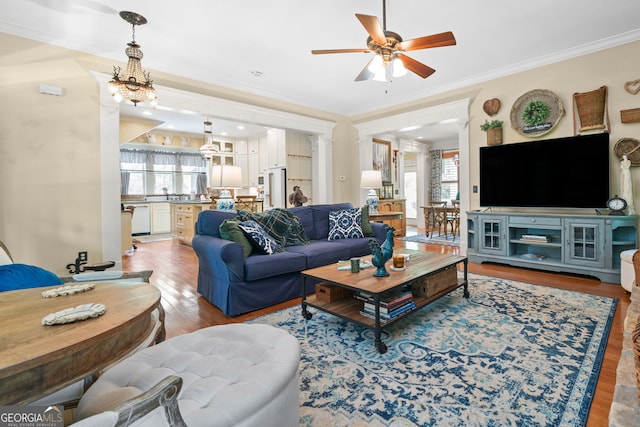 3349 Whitepath Rd, Ellijay, GA 30540 - living area featuring light wood-style flooring, a ceiling fan, ornamental molding, and ornate columns