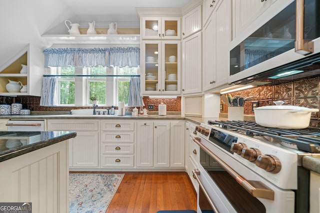 3349 Whitepath Rd, Ellijay, GA 30540 - kitchen featuring white appliances, backsplash, white cabinetry, and glass insert cabinets