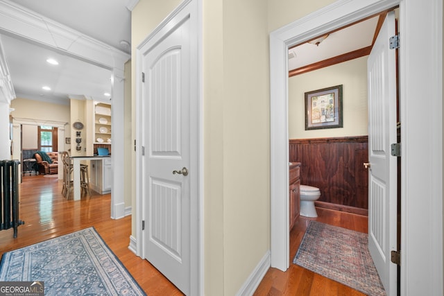 3349 Whitepath Rd, Ellijay, GA 30540 - hallway with light wood-style floors, crown molding, a wainscoted wall, and recessed lighting