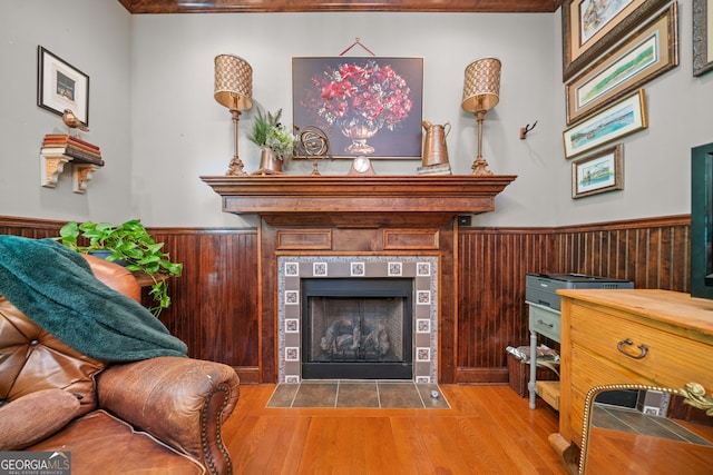 3349 Whitepath Rd, Ellijay, GA 30540 - living area with wainscoting, wood finished floors, a tile fireplace, and wood walls