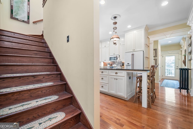 3349 Whitepath Rd, Ellijay, GA 30540 - stairs featuring crown molding, wood finished floors, and recessed lighting