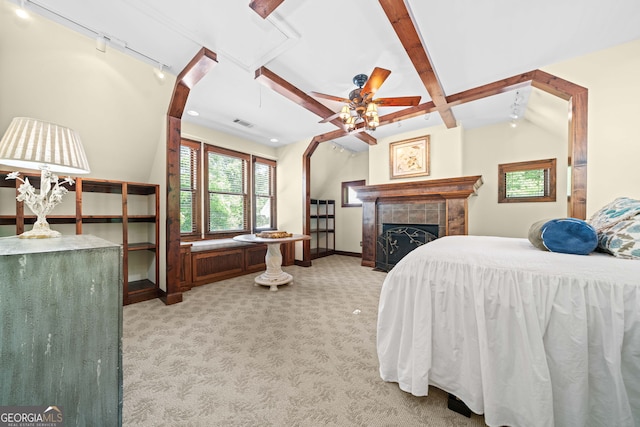 3349 Whitepath Rd, Ellijay, GA 30540 - bedroom with rail lighting, light colored carpet, a tile fireplace, beam ceiling, and attic access