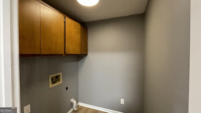 4710 Cedar Brook Dr SE, Conyers, GA 30094 - laundry room with cabinet space, washer hookup, hookup for an electric dryer, and wood finished floors