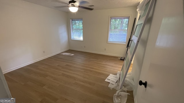 4710 Cedar Brook Dr SE, Conyers, GA 30094 - unfurnished room featuring a ceiling fan, dark wood-type flooring, and a textured ceiling