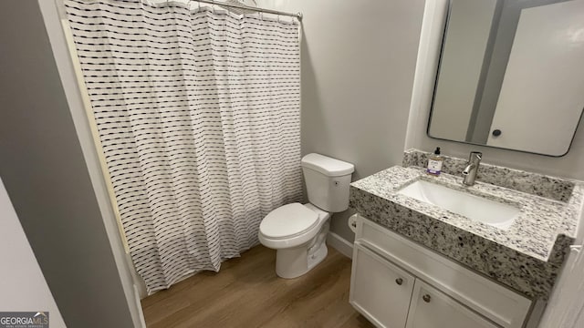 4710 Cedar Brook Dr SE, Conyers, GA 30094 - bathroom with wood finished floors, vanity, and a shower with shower curtain