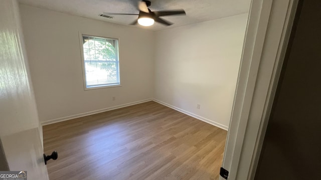 4710 Cedar Brook Dr SE, Conyers, GA 30094 - spare room featuring ceiling fan and wood finished floors