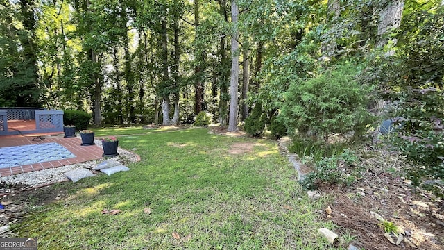 4710 Cedar Brook Dr SE, Conyers, GA 30094 - view of grassy yard with a wooden deck