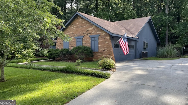 4710 Cedar Brook Dr SE, Conyers, GA 30094 - view of front of house featuring brick siding, a front lawn, concrete driveway, and a shingled roof