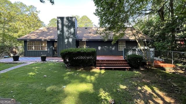 4710 Cedar Brook Dr SE, Conyers, GA 30094 - rear view of property with a wooden deck, a chimney, and roof with shingles
