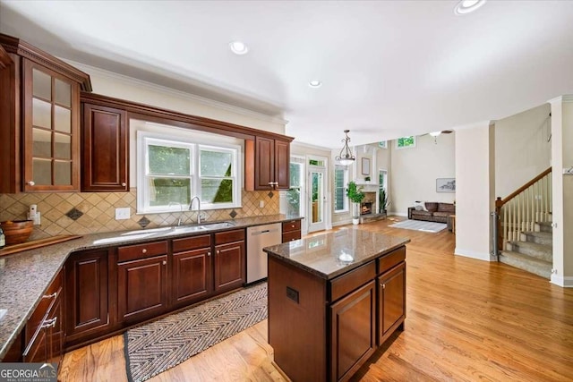 214 Davis Mill Rd, Ball Ground, GA 30107 - kitchen with dishwasher, light wood-style flooring, backsplash, a center island, and ornamental molding