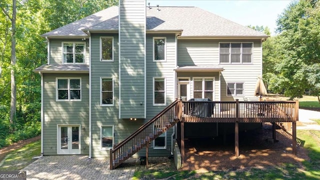 214 Davis Mill Rd, Ball Ground, GA 30107 - back of house featuring stairway, a deck, a chimney, a patio, and a shingled roof