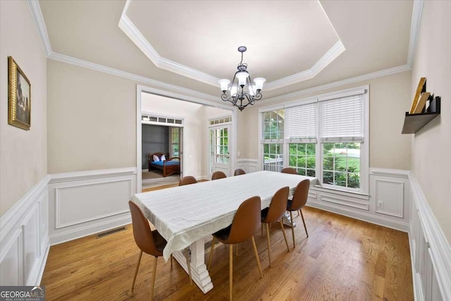 214 Davis Mill Rd, Ball Ground, GA 30107 - dining room featuring a chandelier, a decorative wall, a tray ceiling, ornamental molding, and a wainscoted wall